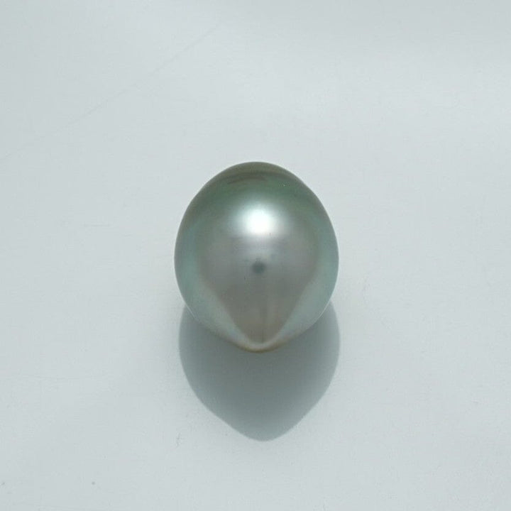 Single lustrous 13.2 x 10.5 mm Fijian Drop Pearl with a smooth, reflective surface and subtle greenish-gray tones casting a soft shadow on a plain background.