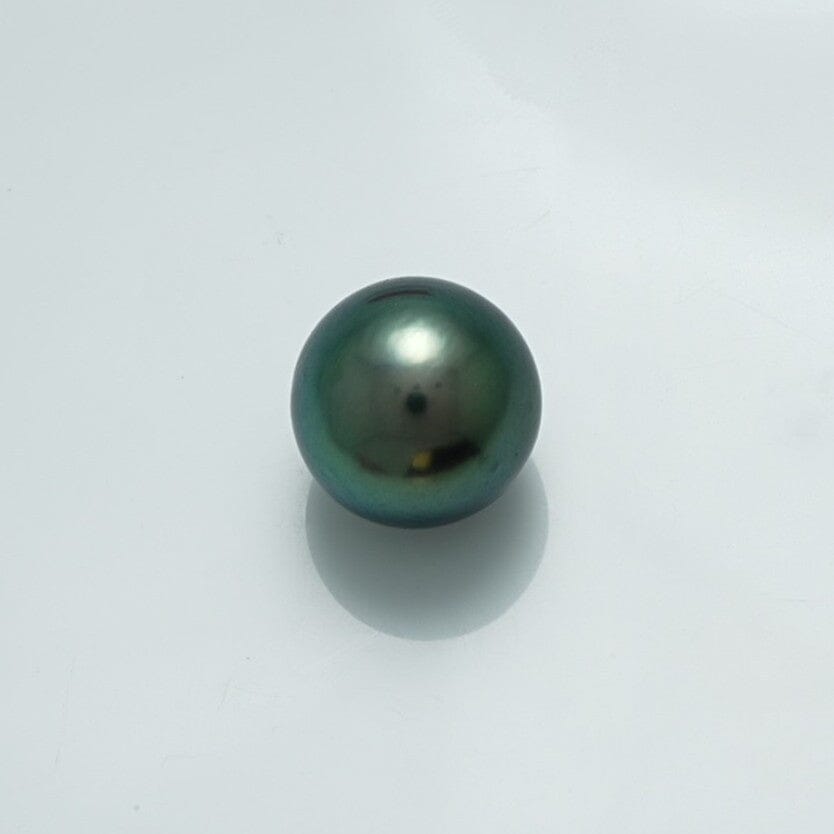 12.7 x 12.6 mm Fijian Pearl with a lustrous dark green and blue iridescent surface, showcasing the natural beauty of cultured South Sea pearls.