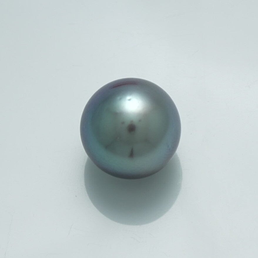 13.3 x 13.3 mm Fijian Pearl with a smooth, lustrous surface showing deep, rich dark tones and subtle iridescent shades, ideal for fine pearl jewelry designs.
