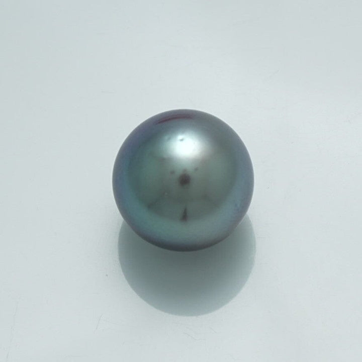 13.3 x 13.3 mm Fijian Pearl with a smooth, lustrous surface showing deep, rich dark tones and subtle iridescent shades, ideal for fine pearl jewelry designs.