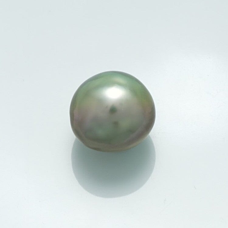 Close-up of a lustrous 10.8 x 9.7 mm Fijian Keshi Pearl with a smooth surface and subtle iridescent green and gray hues on a plain white background.