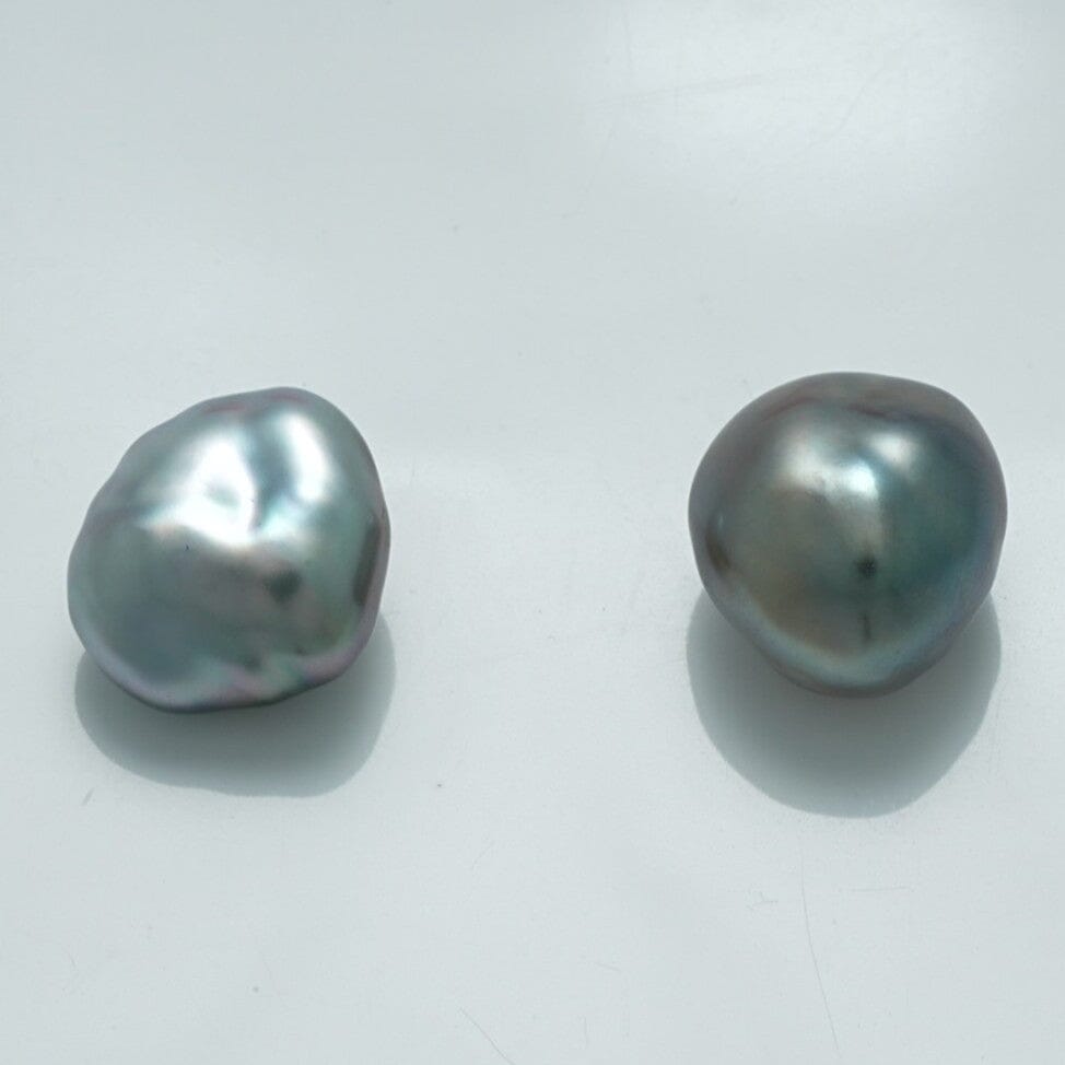 12.5 x 11.2 mm and 12.0 x 11.1 mm Fijian Keshi Pearl Pair showcasing natural baroque shapes with a lustrous, metallic gray finish and subtle iridescent hues.