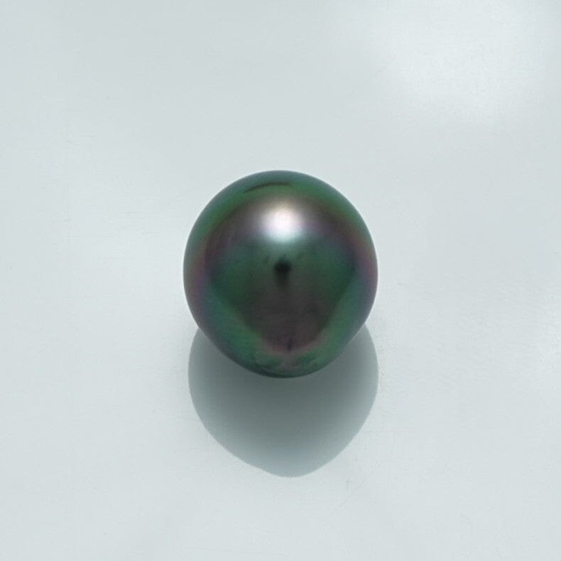 13.5 x 12.2 mm Fijian Drop Pearl showcasing a lustrous deep dark green and subtle iridescent hues, reflecting light gently on a clean white background.