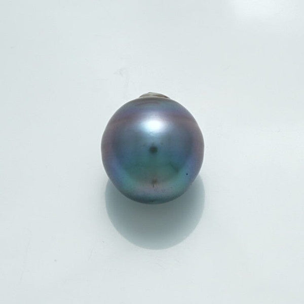 14.0 x 12.8 mm Fijian Drop Pearl with deep iridescent hues of blue, green, and purple, showcasing a smooth surface and natural drop shape unique to cultured pearls.