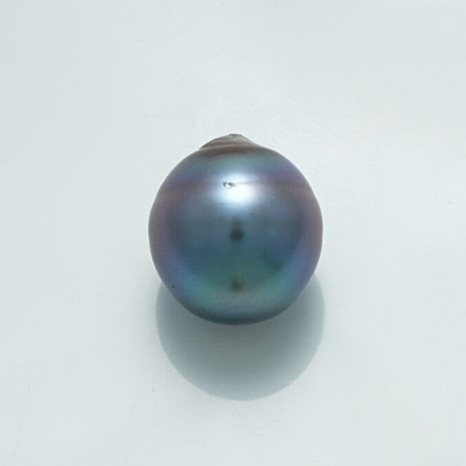 Single lustrous 14.0 x 12.8 mm Fijian Drop Pearl with deep iridescent hues of blue, green, and purple, showcasing a smooth surface and natural drop shape.
