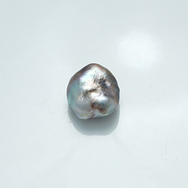 16.0 x 14.6 mm Fijian Keshi Pearl with a natural irregular shape and lustrous surface showcasing subtle shades of silver and gray.