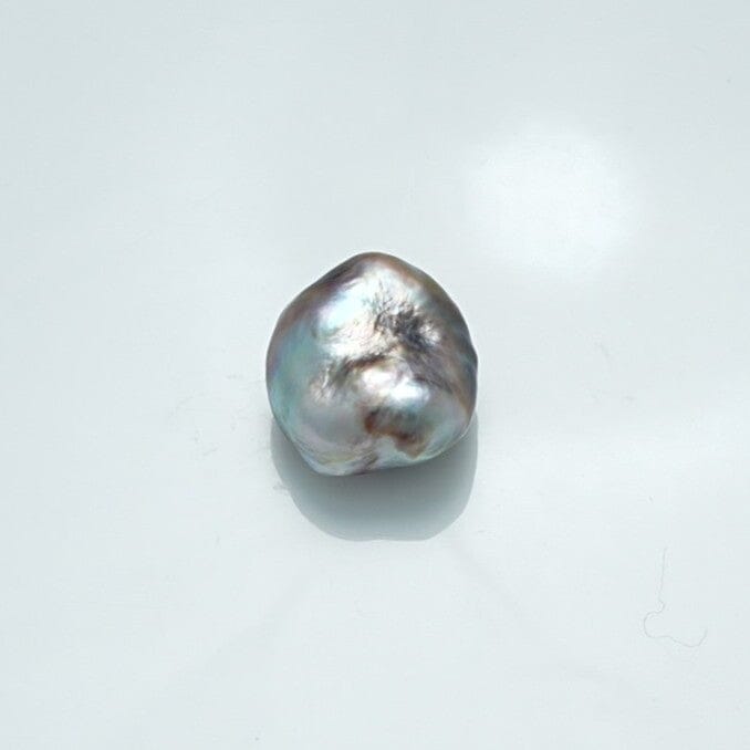 16.0 x 14.6 mm Fijian Keshi Pearl with a natural irregular shape and lustrous surface showcasing subtle shades of silver and gray.
