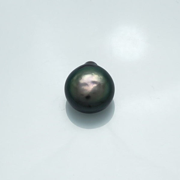 16.6 x 15.0 mm Fijian Keshi Pearl with deep dark green and black hues, showcasing natural luster and organic baroque shape on a plain white background.