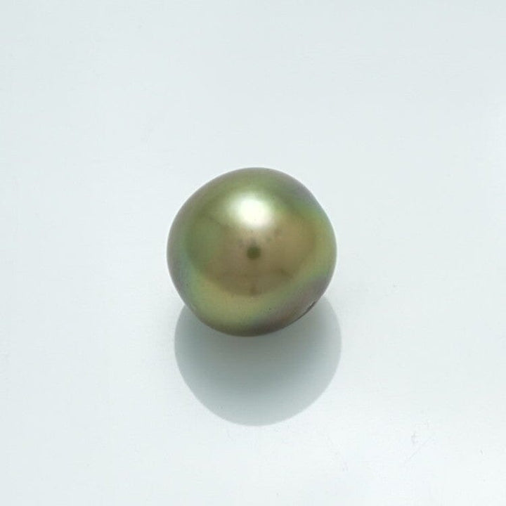 9.7 x 9.6 mm Fijian Round Pearl with a smooth, lustrous surface showcasing subtle green and gold tones on a clean white background.