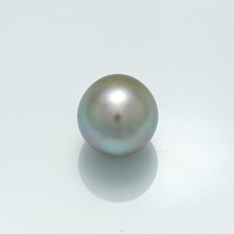 Single lustrous 10.2 x 10.0 mm Fijian Drop Pearl with a smooth surface and subtle iridescent tones on a light background.
