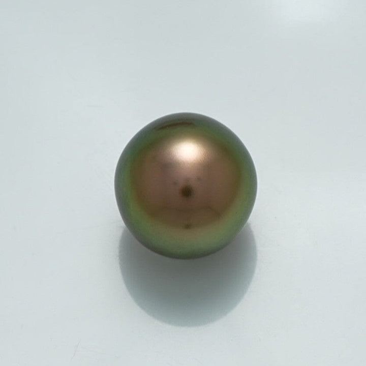 13.1 x 12.6 mm Fijian Drop Pearl with a smooth, lustrous surface displaying rich green and bronze overtones, perfect for fine pearl jewelry.