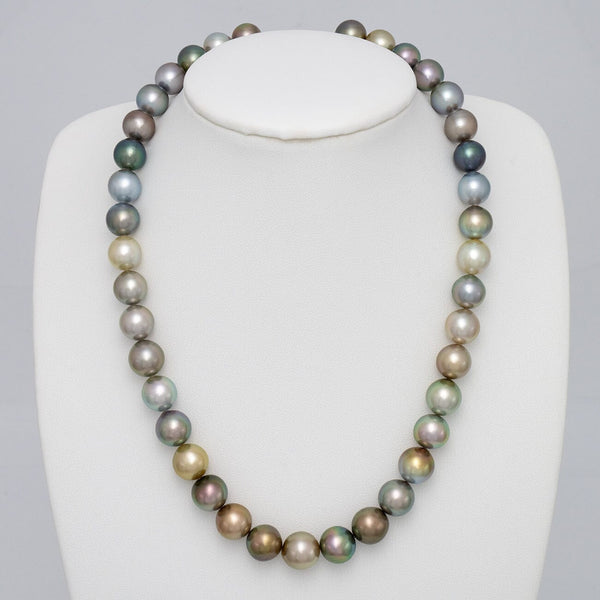 Assael Collection: 9.4–11.1 mm Fijian Pearl Necklace displaying a strand of multi-colored cultured pearls in shades of green, blue, gold, and lavender on a white jewelry bust.