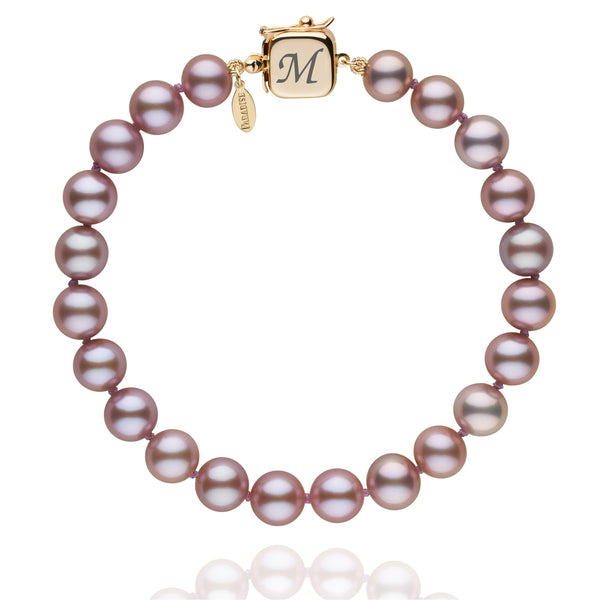 Personalized 7.5-8.0 mm Lavender Freshadama Freshwater Pearl Square Clasp Bracelet featuring luminous lavender freshwater pearls and a gold square clasp engraved with an initial.