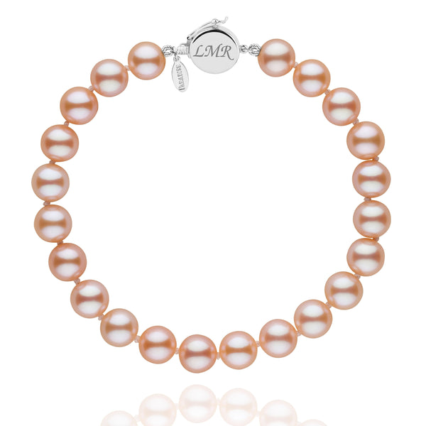 Personalized 7.5-8.0 mm Pink to Peach Freshadama Freshwater Pearl Circle Clasp Bracelet featuring lustrous round freshwater pearls with a polished 14K white gold circle clasp engraved with initials.