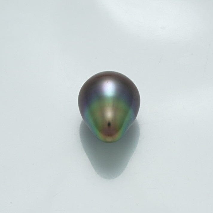 Single lustrous 13.6 x 10.5 mm Fijian Drop Pearl exhibiting deep metallic green and purple hues with a smooth, teardrop-shaped surface ideal for fine pearl jewelry.