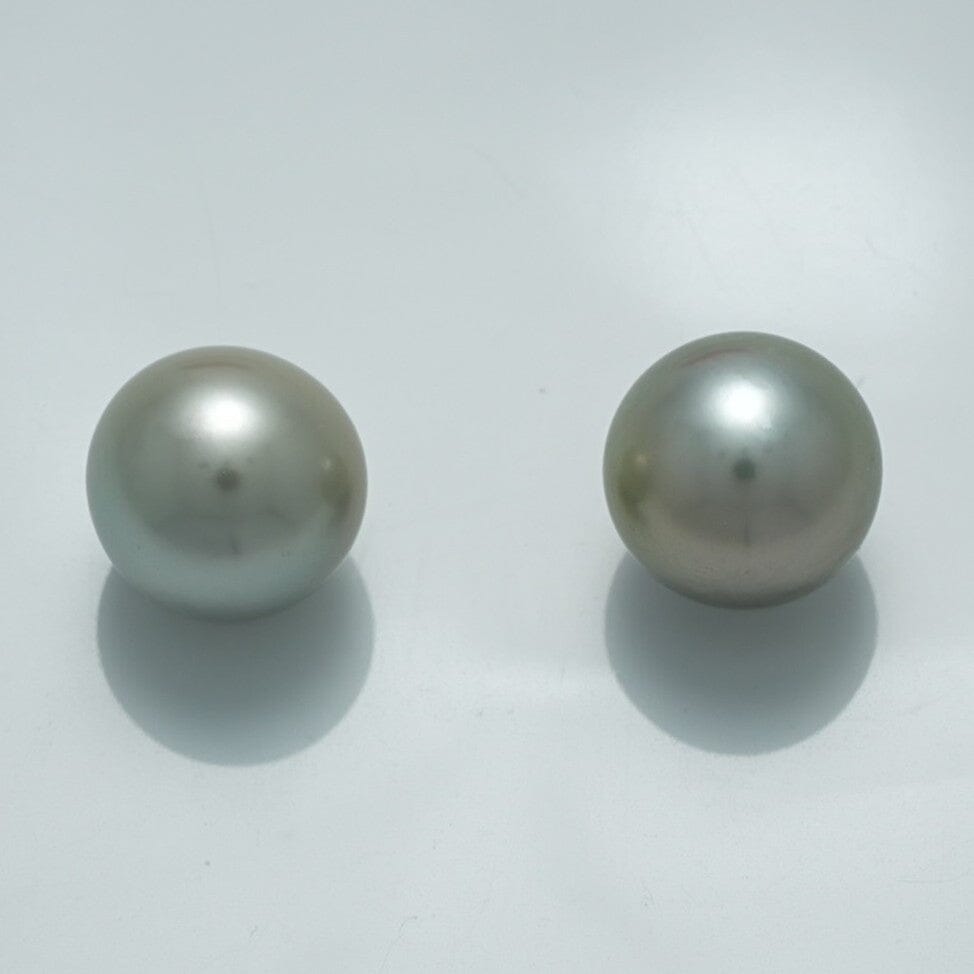 10.9 x 10.8 mm and 10.8 x 10.8 mm Fijian Pearl Pair with smooth surfaces and soft silver-gray luster, showcasing high-quality natural cultured pearls.