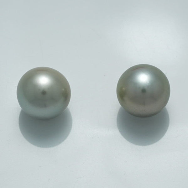 10.9 x 10.8 mm and 10.8 x 10.8 mm Fijian Pearl Pair with smooth surfaces and soft silver-gray luster, showcasing high-quality natural cultured pearls.