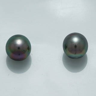 10.1 x 9.5 mm and 9.9 x 9.6 mm Fijian Drop Pearl Pair showcasing lustrous dark pearls with subtle iridescent hues against a plain white background.