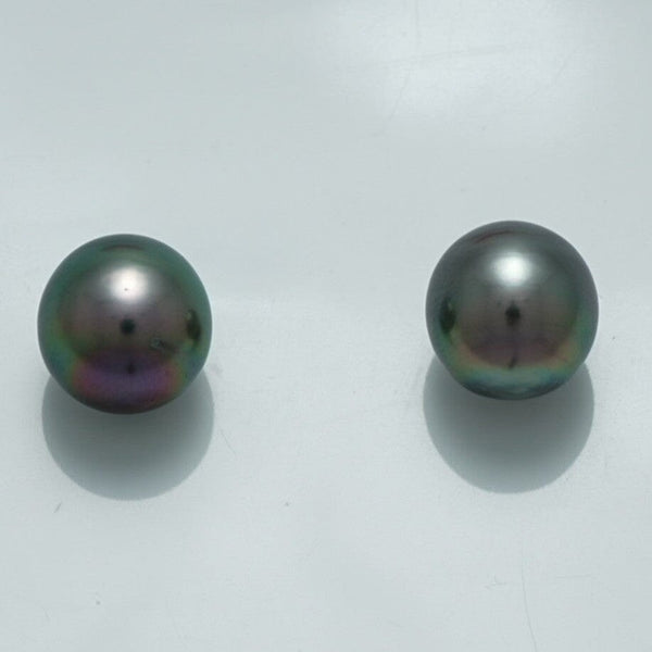 10.1 x 9.5 mm and 9.9 x 9.6 mm Fijian Drop Pearl Pair showcasing lustrous dark pearls with subtle iridescent hues against a plain white background.