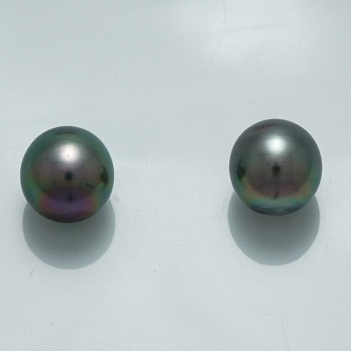 10.1 x 9.5 mm and 9.9 x 9.6 mm Fijian Drop Pearl Pair showcasing lustrous dark pearls with subtle iridescent hues against a plain white background.