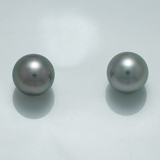 9.4 x 9.4 mm and 9.4 x 9.4 mm Fijian Pearl Pair featuring smooth, lustrous dark gray pearls with subtle iridescent sheen on a clean white background.