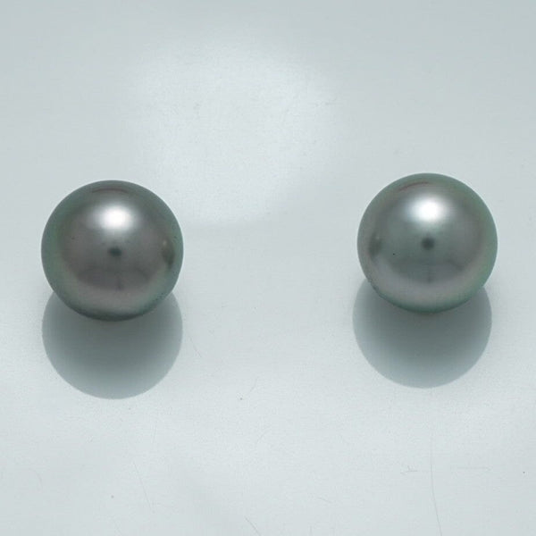 9.4 x 9.4 mm and 9.4 x 9.4 mm Fijian Pearl Pair featuring smooth, lustrous dark gray pearls with subtle iridescent sheen on a clean white background.