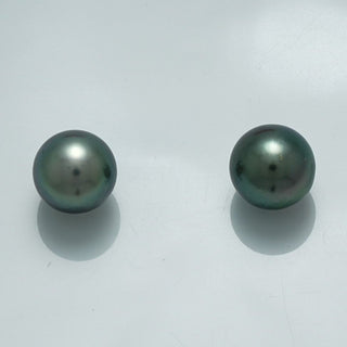9.5 x 9.3 mm and 9.4 x 9.2 mm Fijian Pearl Pair in deep greenish-black hues with smooth surfaces, showcasing the natural luster of fine cultured pearls.