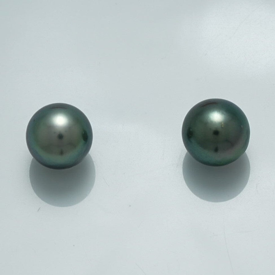 9.5 x 9.3 mm and 9.4 x 9.2 mm Fijian Pearl Pair in deep greenish-black hues with smooth surfaces, showcasing the natural luster of fine cultured pearls.