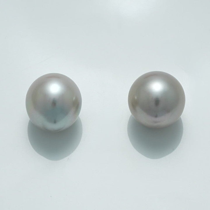 12.8 x 11.7 mm and 12.4 x 11.9 mm Fijian Drop Pearl Pair showcasing lustrous, smooth, round grey pearls with subtle overtones, perfect for elegant pearl jewelry designs.