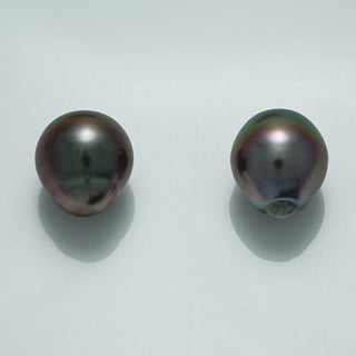 12.9 x 11.0 mm and 12.3 x 11.1 mm Fijian Drop Pearl Pair with deep black and iridescent green and purple hues, showcasing natural luster and smooth surface.