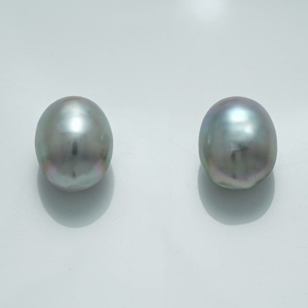 12.7 x 10.3 mm and 12.6 x 10.2 mm Fijian Drop Pearl Pair in soft gray hues with subtle iridescent overtones, showcasing natural drop-shaped cultured pearls.