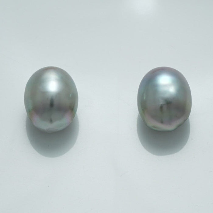 12.7 x 10.3 mm and 12.6 x 10.2 mm Fijian Drop Pearl Pair in soft gray hues with subtle iridescent overtones, showcasing natural drop-shaped cultured pearls.