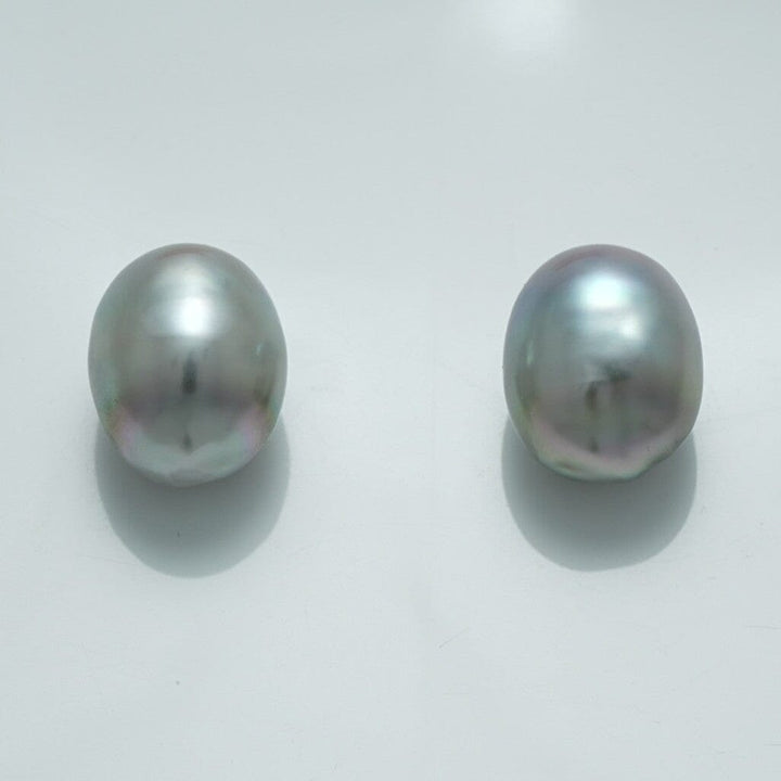 12.7 x 10.3 mm and 12.6 x 10.2 mm Fijian Drop Pearl Pair in soft gray hues with subtle iridescent overtones, showcasing natural drop-shaped cultured pearls.