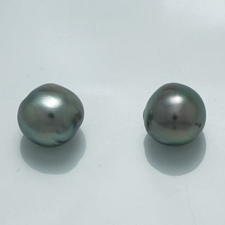 10.2 x 9.8 mm and 9.7 x 9.6 mm Fijian Semi-Baroque Pearl Pair with lustrous dark green and gray tones, showcasing natural irregular shapes and glossy surfaces.