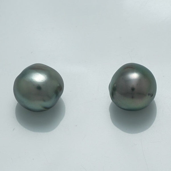 10.2 x 9.8 mm and 9.7 x 9.6 mm Fijian Semi-Baroque Pearl Pair with lustrous dark green and gray tones, showcasing natural irregular shapes and glossy surfaces.