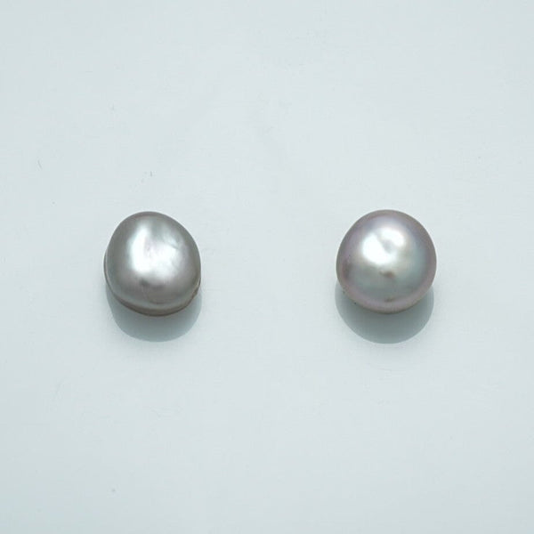 9.6 x 9.0 mm and 9.6 x 8.6 mm Fijian Keshi Button Pearl Pair with lustrous, irregular shapes showcasing natural white and soft lavender hues.