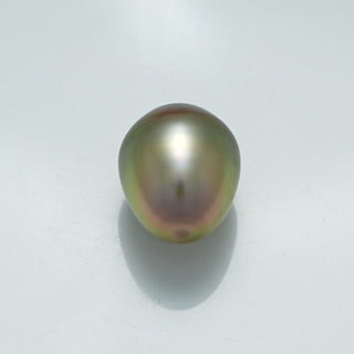 Single lustrous 13.3 x 10.6 mm Fijian Drop Pearl with a smooth surface and natural greenish-black hues, perfect for creating elegant pearl jewelry.