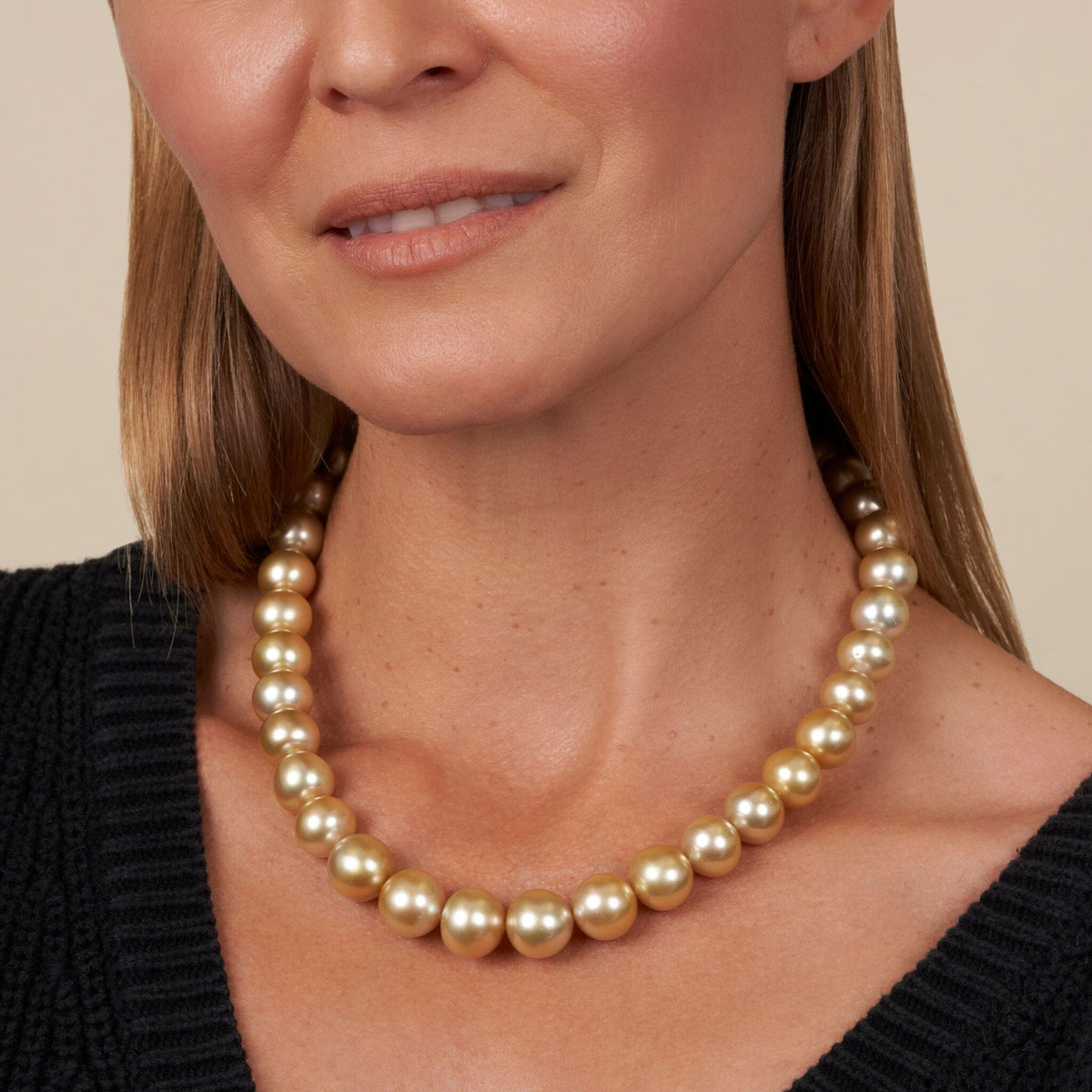 12.0-14.7 mm AA+/AAA Golden South Sea Round Pearl Necklace on blond model