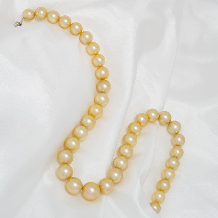 J-16: 10-13.8 mm Round Golden South Sea Pearl Strand