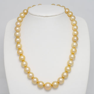 10.0–13.8 mm round Golden South Sea pearl necklace shown from a second angle on a white background