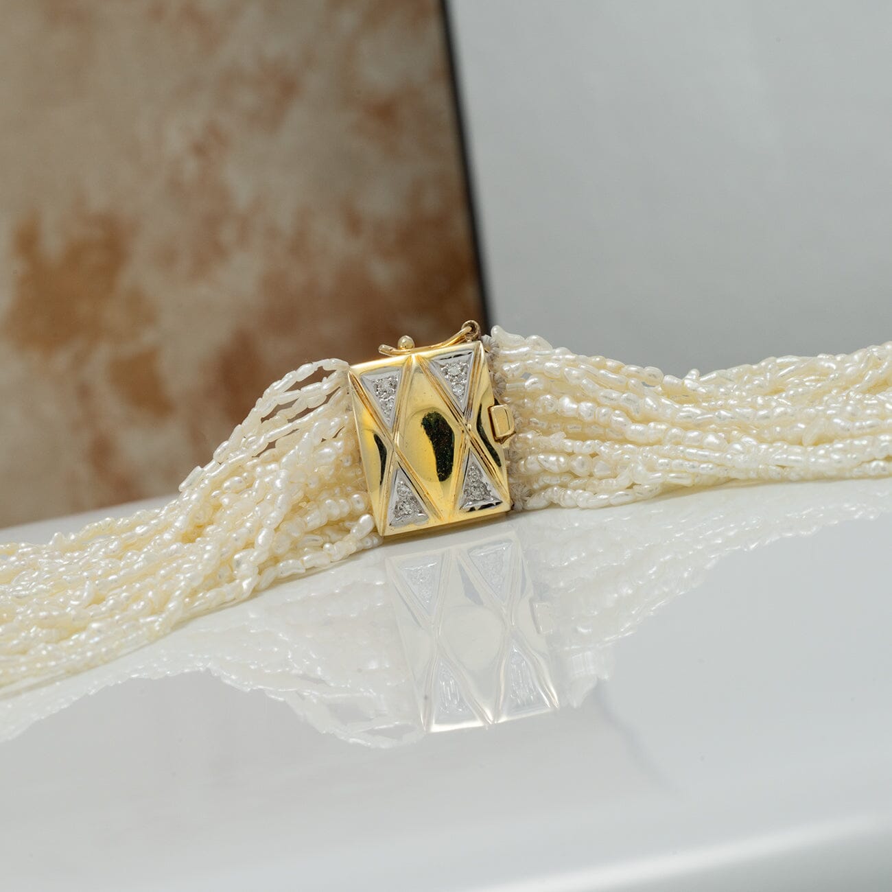 JF22: 1.0-3.0 mm 20 Strand Akoya Keshi Pearl Torsade Diamond Clasp