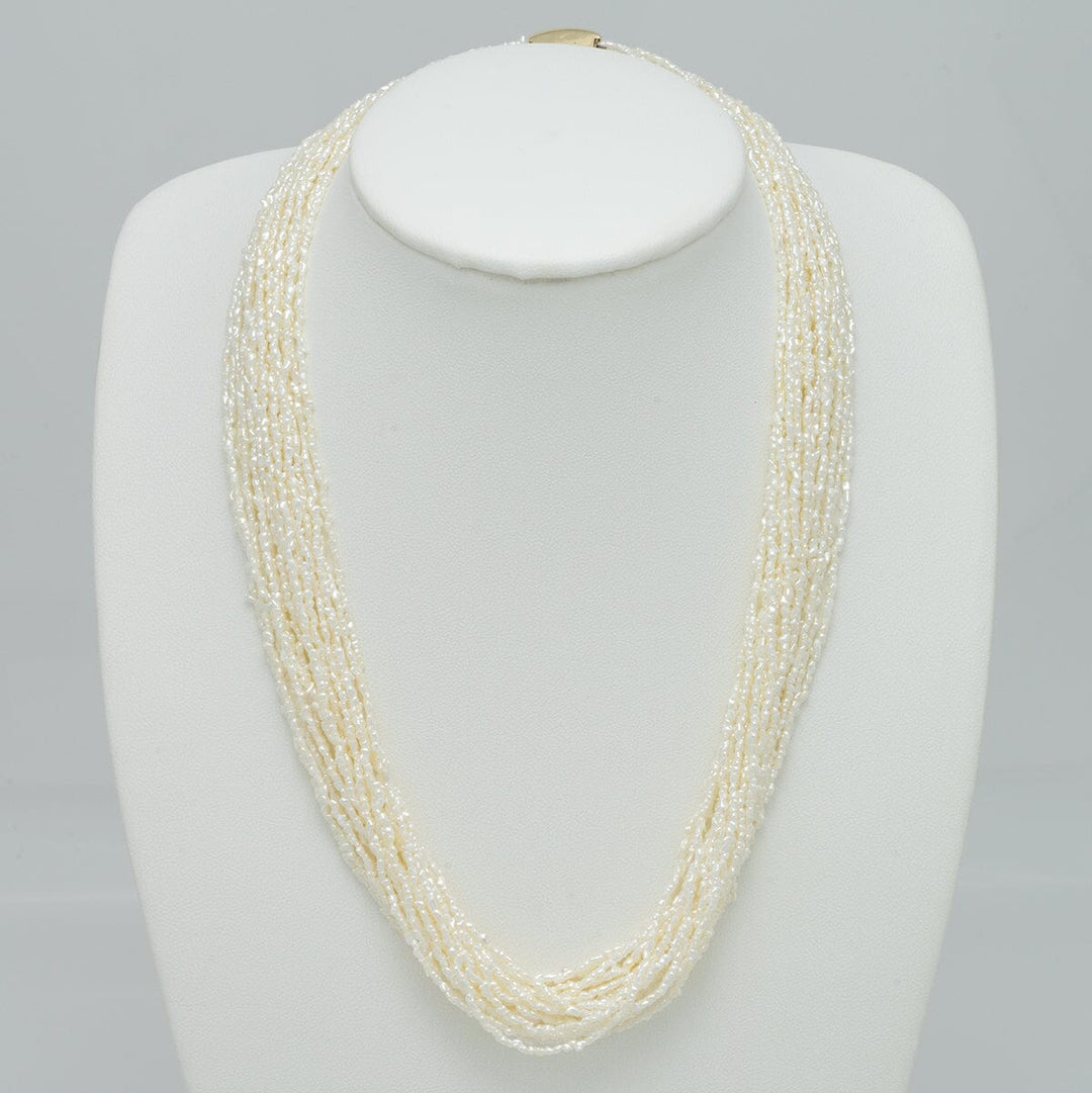 1.0-3.0 mm 20 Strand Akoya Keshi Pearl Torsade Diamond Clasp Necklace displayed on a white bust, featuring multiple strands of delicate white akoya pearls with a sparkling diamond clasp.