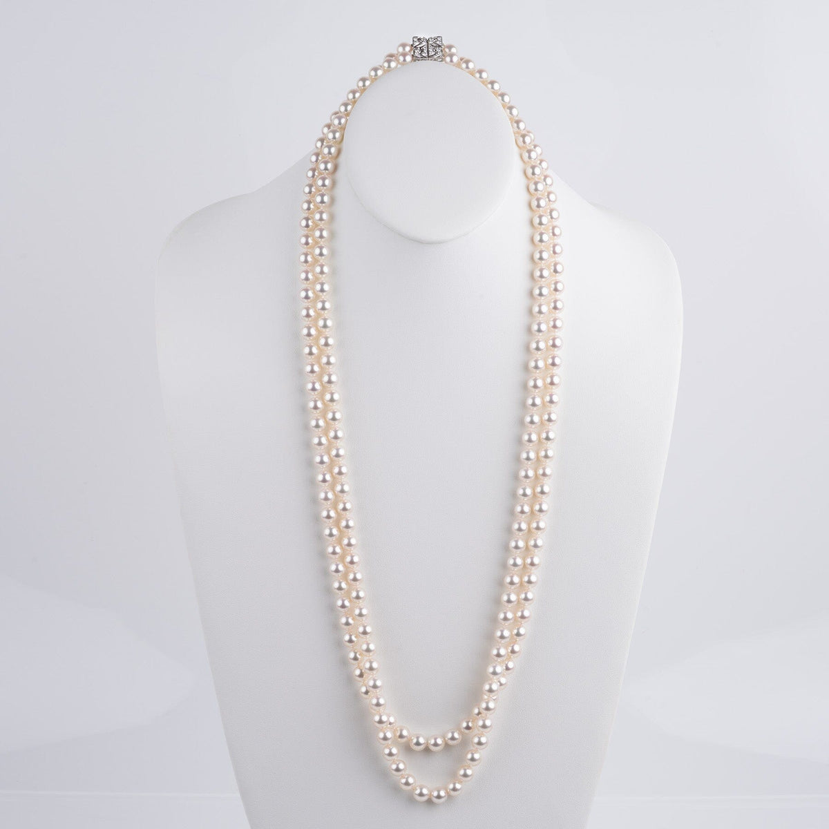 Assael Collection: 9.0–9.5 mm White Akoya Double Strand Necklace, 35 inches displayed on a white bust stand, featuring lustrous cultured white pearls in a classic elegant design.