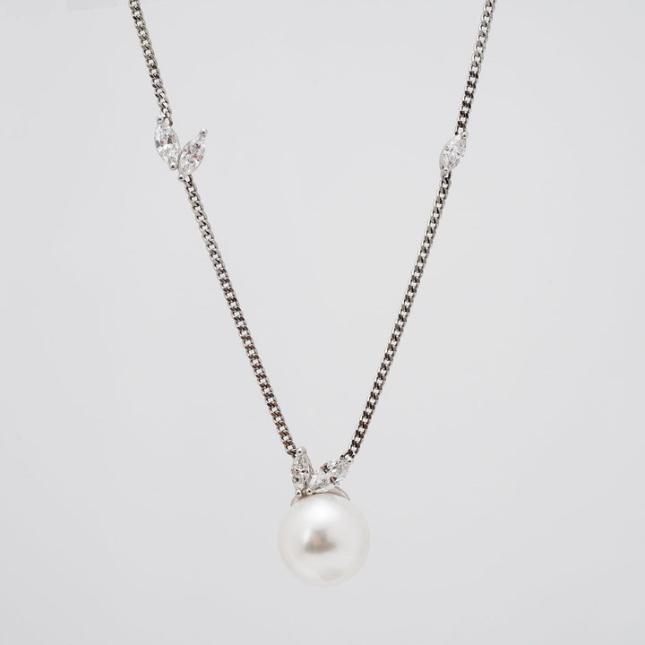 Assael Collection: 10.5-11.0 mm White South Sea Pearl and Diamond Pendant featuring a lustrous white pearl with delicate diamond accents on a fine silver chain.