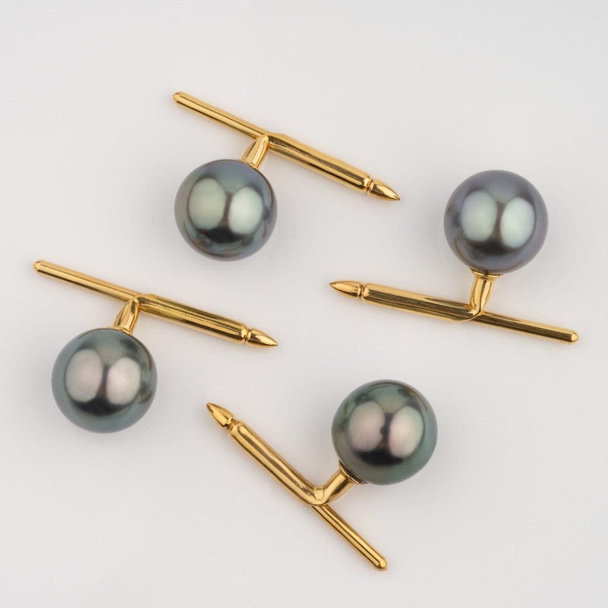 Assael Collection: 10.5–11.0 mm, Set of 4 Tahitian Pearl Tuxedo Studs with lustrous dark pearls and elegant gold hardware, perfect for formal attire and refined style.