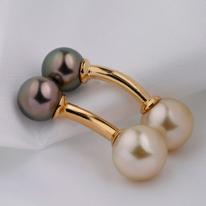 Pair of Assael Collection: 9.0–11.4 mm Tahitian and Gold South Sea Cufflinks featuring lustrous black and white pearls set on polished gold cufflink bars.
