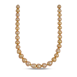 A strand of golden South Sea baroque pearl necklace with a clasp.