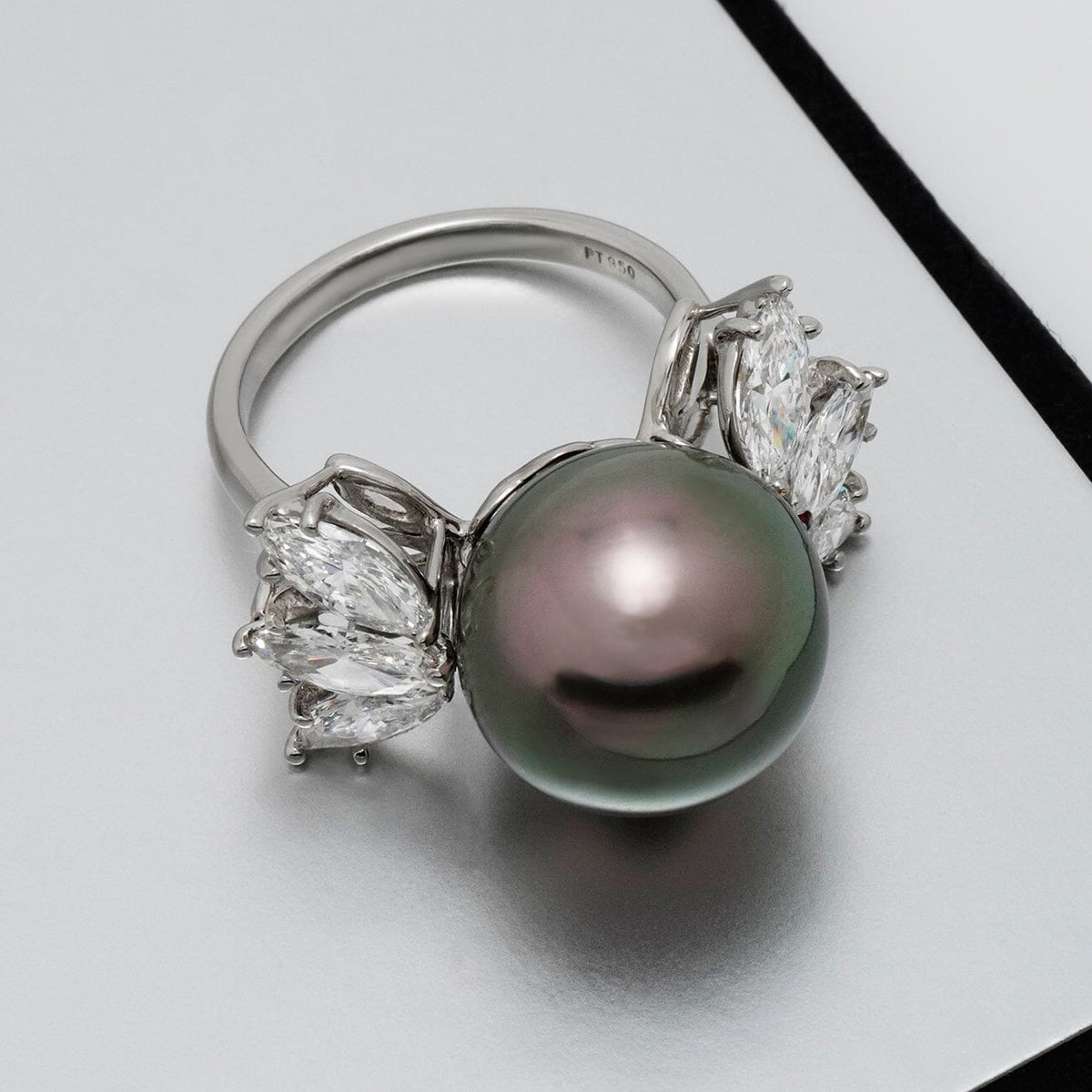 Assael Collection: 14.2 mm Tahitian Pearl and Diamond Ring featuring a large dark Tahitian pearl centerpiece flanked by sparkling marquise-cut diamonds on a polished band.