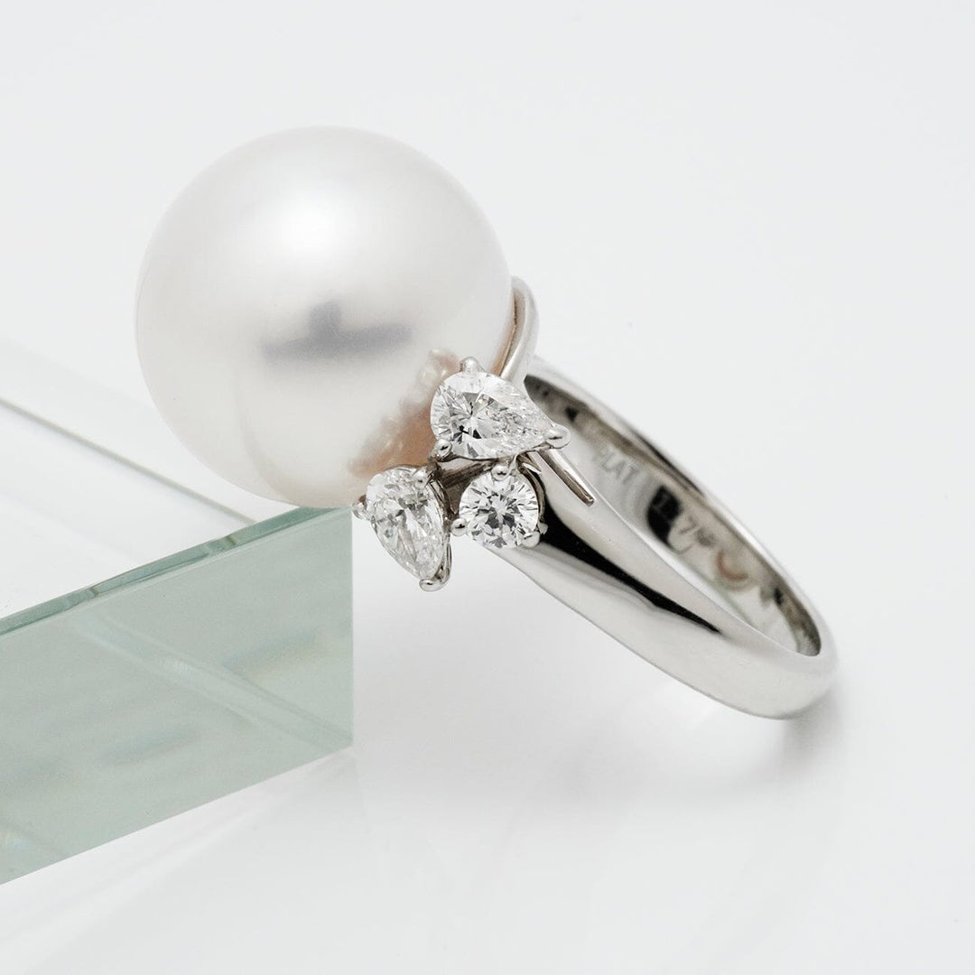 Assael Collection: 15.7 mm White South Sea Pearl and Diamond Ring featuring a large white pearl and three sparkling diamond accents on a sleek polished band.