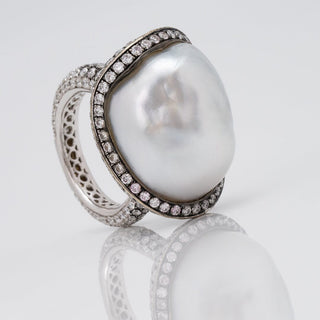 Assael Collection: 22.2 x 18.1 x 17.0 mm Baroque White South Sea Pearl and Diamond Ring featuring a large baroque pearl surrounded by a halo of diamonds on an intricately designed band.